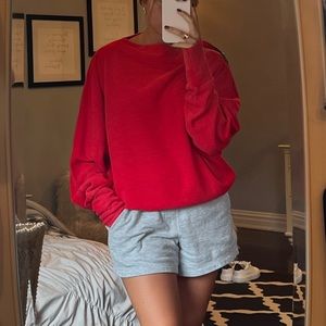 Long sleeve red shirt with zipper on shoulder